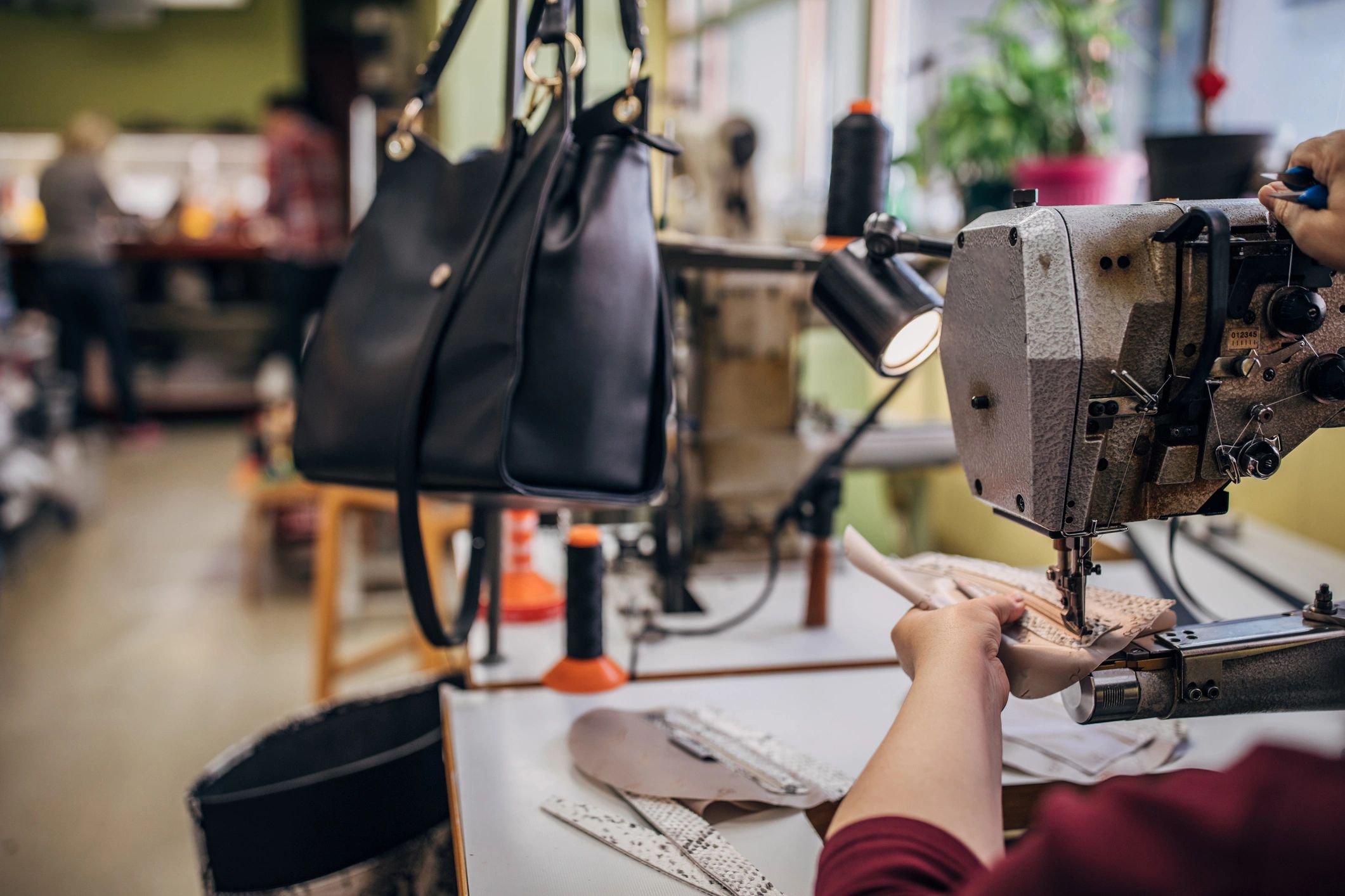 Sewing machine used for leather goods production